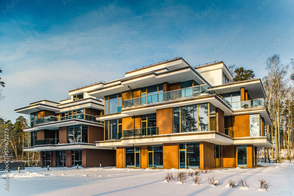 Fototapeta premium Modern exterior of new luxury residential building at winter.