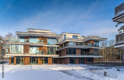 Modern exterior of new luxury residential building at winter.