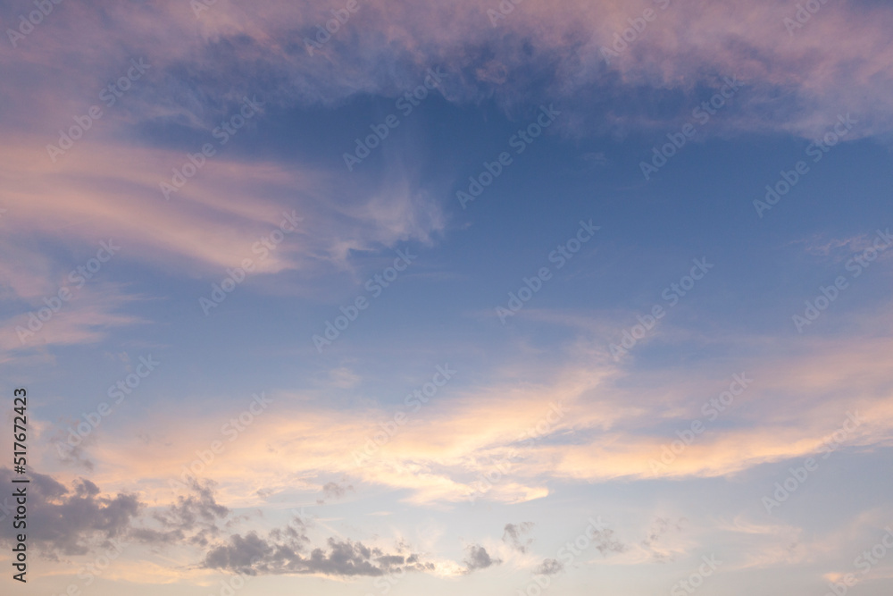 Amazing wispy sunset sky with pink clouds in spring in Norfolk England. Cloudscape scene with no people