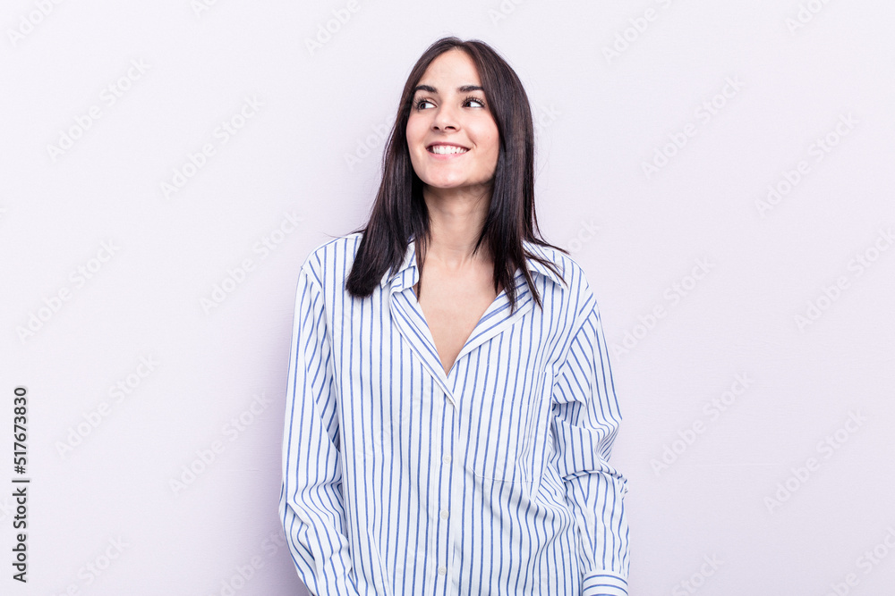 Young caucasian woman isolated on pink background relaxed and happy laughing, neck stretched showing teeth. Young caucasian woman isolated on pink background relaxed and happy laughing, neck stretched showing teeth.