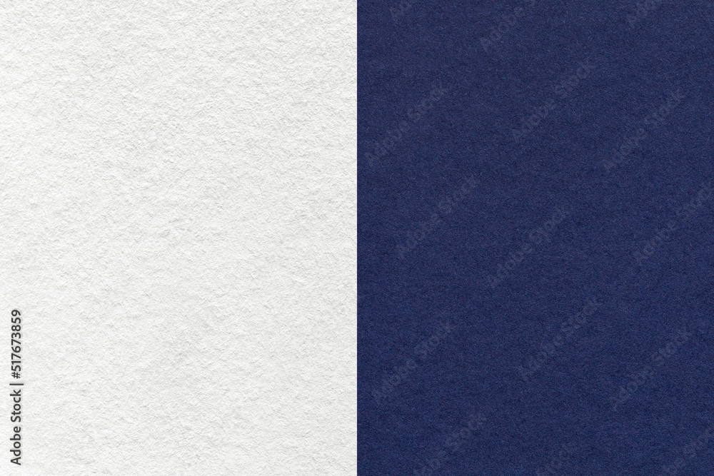 Fototapeta premium Texture of craft white and navy blue paper background, half two colors, macro. Structure of vintage dense denim cardboard.