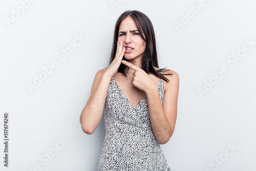 Young caucasian woman isolated on white background having a strong teeth pain, molar ache.