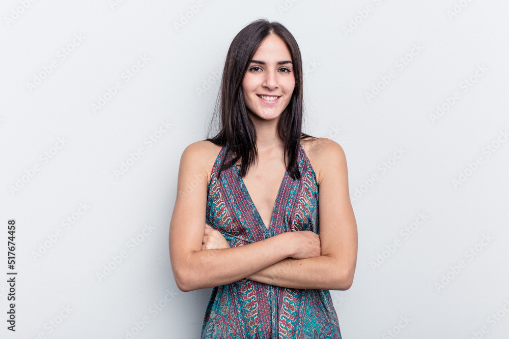 Young caucasian woman isolated on white background who feels confident, crossing arms with determination. Young caucasian woman isolated on white background who feels confident, crossing arms with determination.