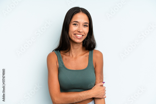 Papier peint hispanic pretty woman laughing shyly and cheerfully, with a friendly and positiv
