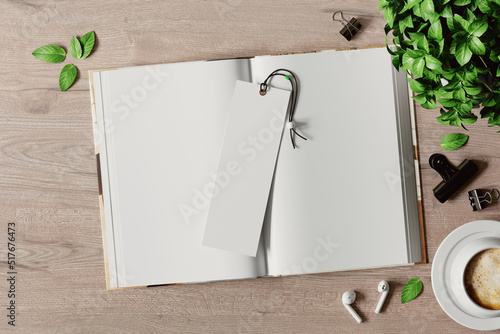 Open book with a bookmark on the table mockup. 3D rendering photo