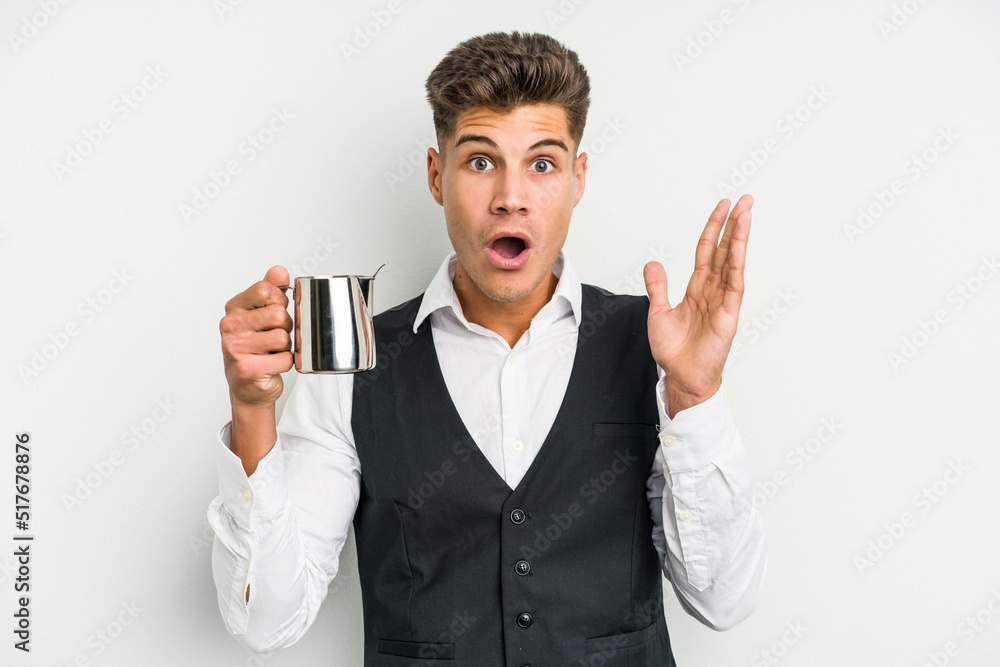 Young caucasian barista man isolated on yellow background surprised and shocked. Young caucasian barista man isolated on yellow background surprised and shocked.