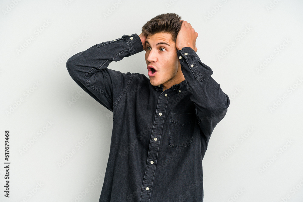 Young caucasian man isolated on white background screaming, very excited, passionate, satisfied with something. Young caucasian man isolated on white background screaming, very excited, passionate, satisfied with something.