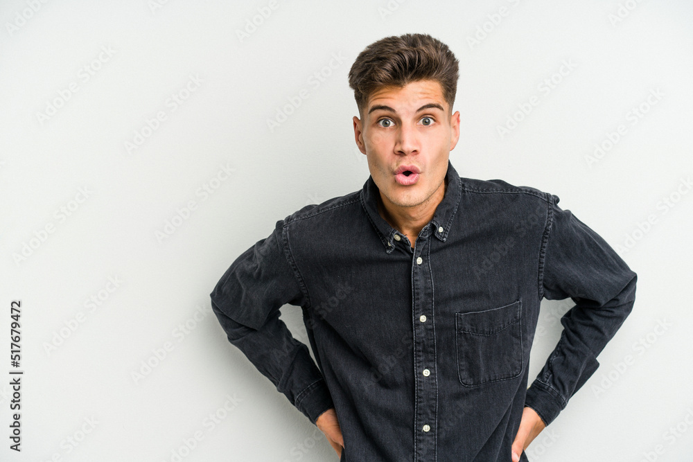 Young caucasian man isolated on white background being shocked because of something she has seen. Young caucasian man isolated on white background being shocked because of something she has seen.