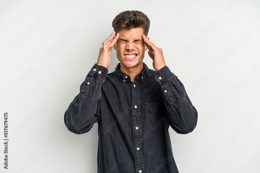 Young caucasian man isolated on white background touching temples and having headache. Young caucasian man isolated on white background touching temples and having headache.