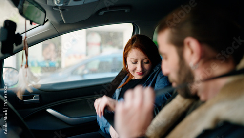 Man and woman couple smiling confident driving car at street © Krakenimages.com
