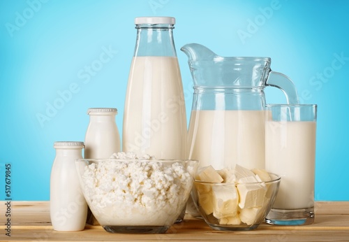 Milk, yogurt, cheese, butter on light table, variety of dairy products