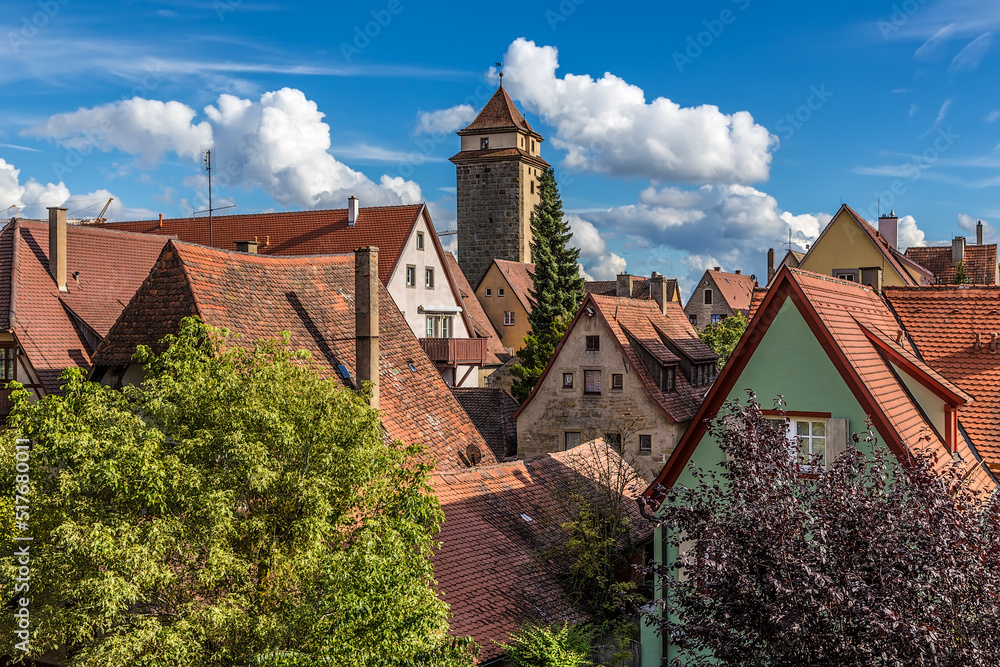 Rothenburg ob der Tauber, Germany. Beautiful view of the old town with a medieval tower Rothenburg ob der Tauber, Germany. Beautiful view of the old town with a medieval tower