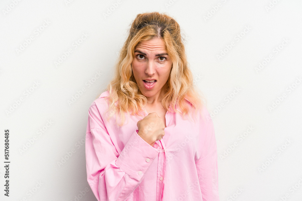 Young caucasian woman isolated on white background surprised pointing with finger, smiling broadly. Young caucasian woman isolated on white background surprised pointing with finger, smiling broadly.