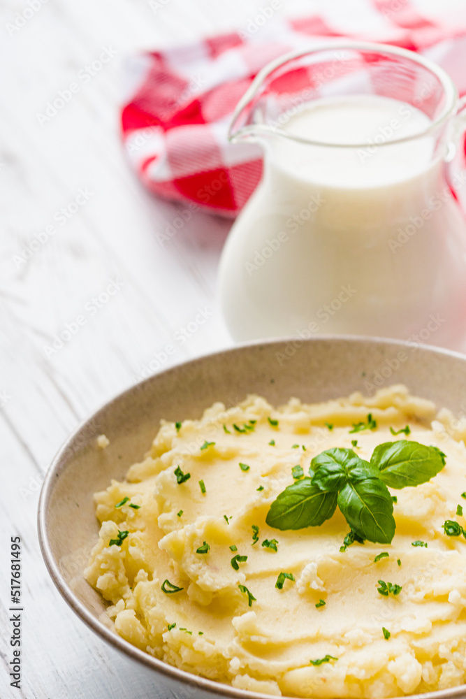 fresh tasty mashed potatoes on a white wooden rustic background fresh tasty mashed potatoes on a white wooden rustic background