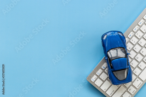 Toy car near computer keyboard - rent or purchase a car concept © 9dreamstudio