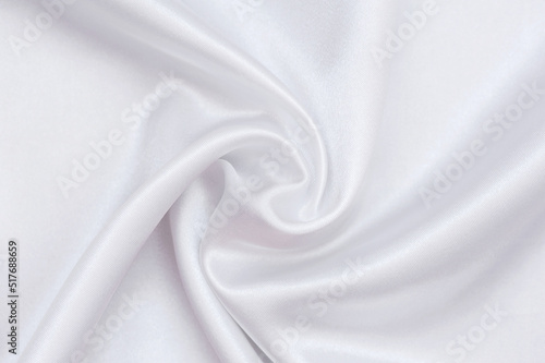 White silk fabric as an abstract background. white silk background.