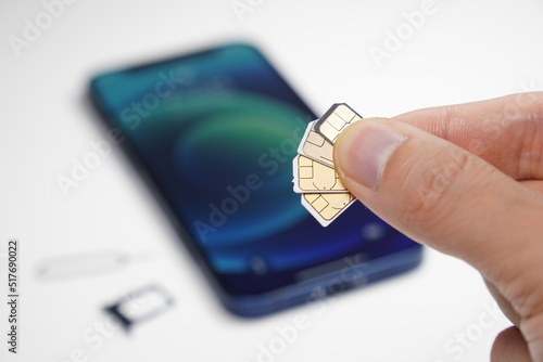 iPhone and several SIM cards.