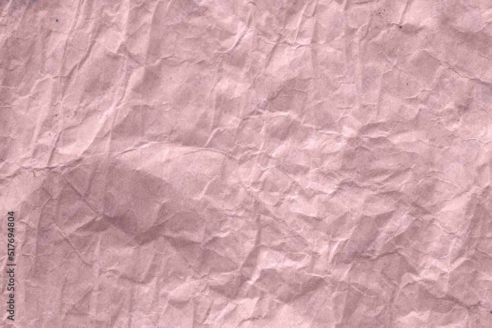 High detail of the abstract texture of the packaging paper. The texture of crumpled pink craft paper. Crumpled pink paper background top view. The texture of crumpled pink paper. Space for text. High detail of the abstract texture of the packaging paper. The texture of crumpled pink craft paper. Crumpled pink paper background top view. The texture of crumpled pink paper. Space for text.