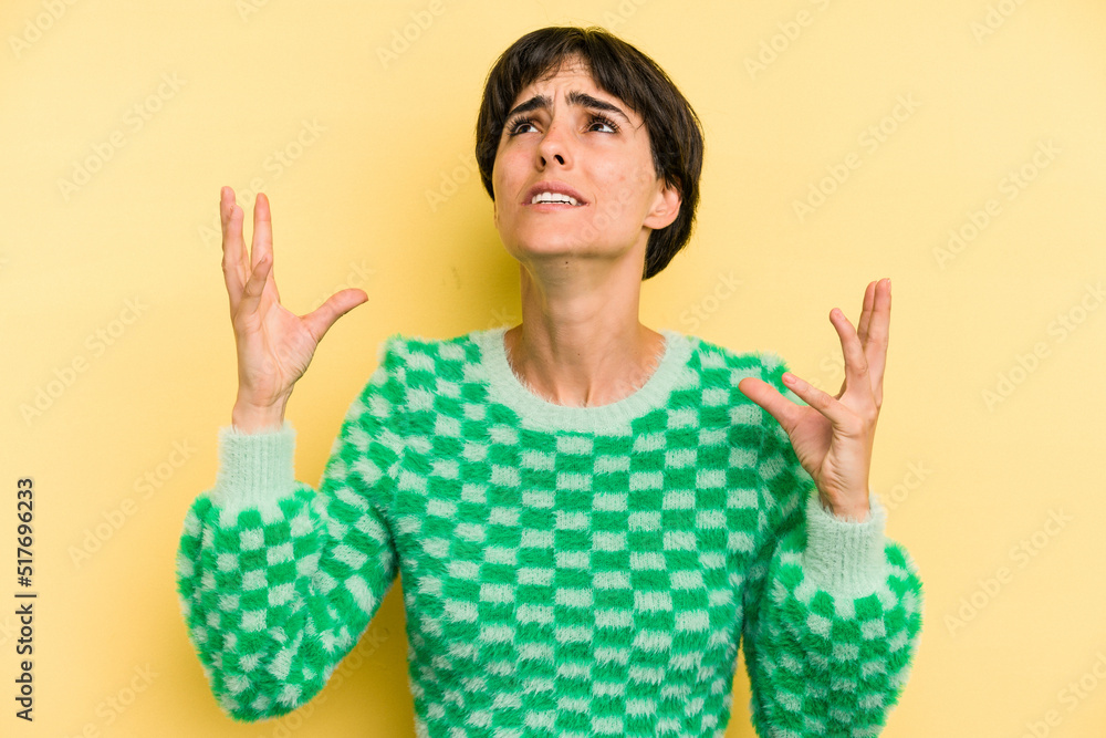 Young caucasian woman with a short hair cut isolated screaming to the sky, looking up, frustrated. Young caucasian woman with a short hair cut isolated screaming to the sky, looking up, frustrated.