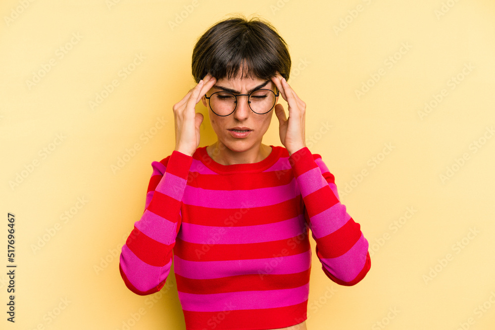 Young caucasian woman with a short hair cut isolated having a head ache, touching front of the face. Young caucasian woman with a short hair cut isolated having a head ache, touching front of the face.