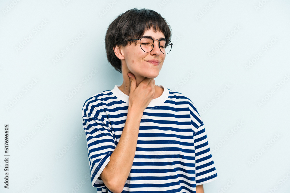 Young caucasian woman with a short hair cut isolated suffers pain in throat due a virus or infection. Young caucasian woman with a short hair cut isolated suffers pain in throat due a virus or infection.