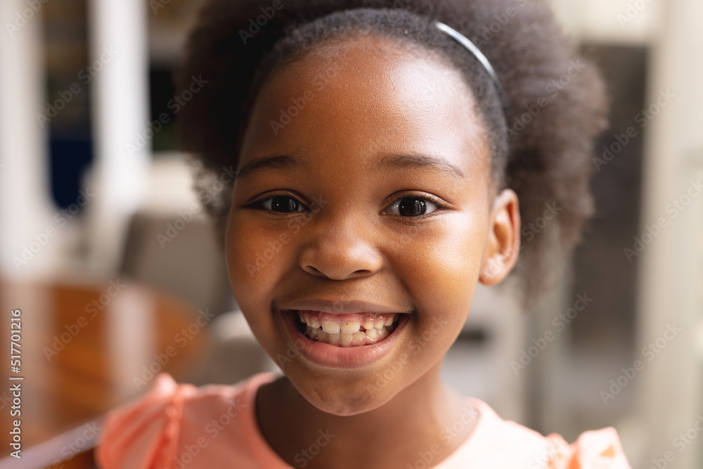 Image of happy african american girl looking at camera Image of happy african american girl looking at camera