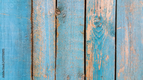 Weathered wooden wall painted of blue