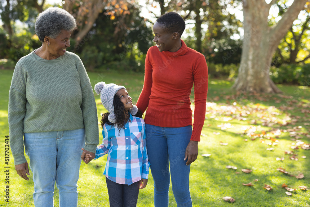 Image of happy african american three generation women in garden Image of happy african american three generation women in garden