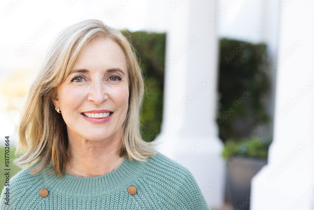 Image of happy senior caucasian woman smiling at camera Image of happy senior caucasian woman smiling at camera