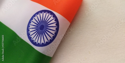 Tricolor official flag of india. August 15 independence and january 26 republic day festival concept. Blue ashoka chakra symbol between green and saffron color. Closeup horizontal view with copy space photo