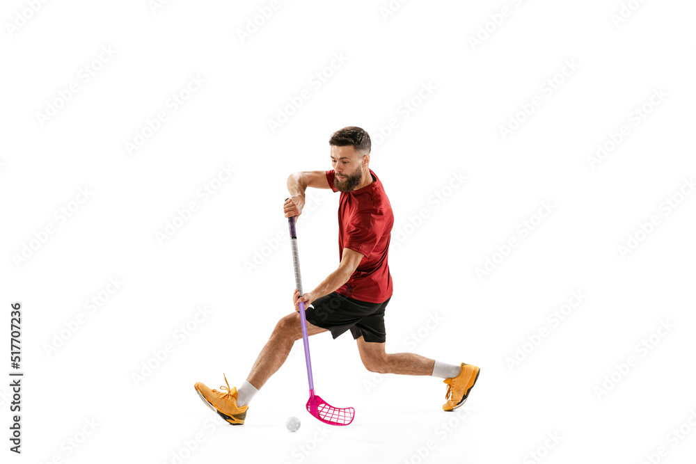 Floorball male player with floorball stick training isolated on white studio background. Sport, action and motion, movement, healthy lifestyle Floorball male player with floorball stick training isolated on white studio background. Sport, action and motion, movement, healthy lifestyle