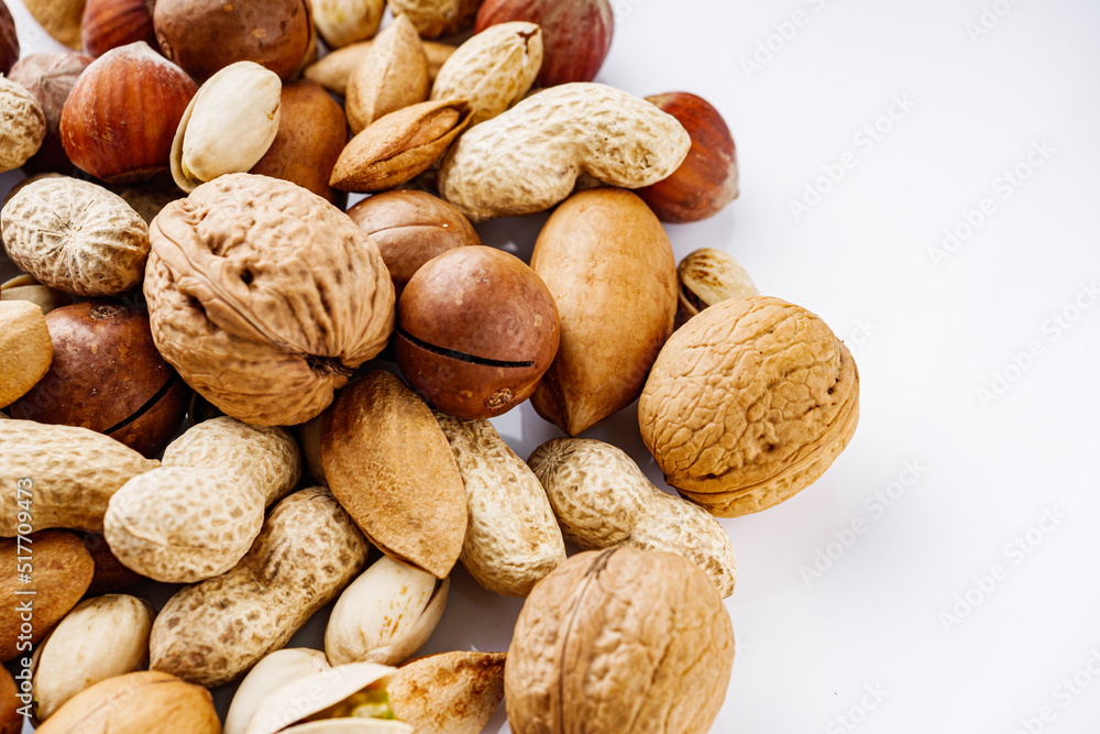 set of different nuts on a white acrylic background set of different nuts on a white acrylic background