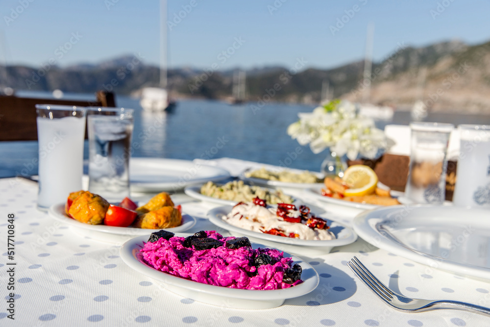 Luxurious restaurant table ready to serve at the coast of Mediterranean Sea Luxurious restaurant table ready to serve at the coast of Mediterranean Sea