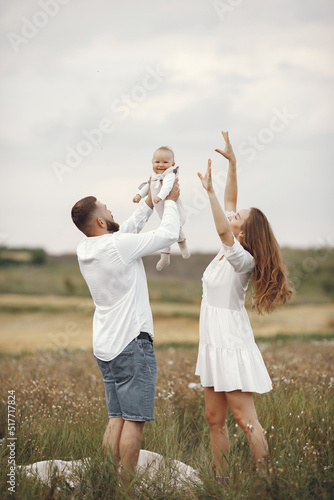 Family spend time in a summer field