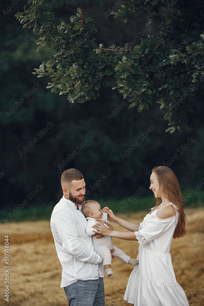Family spend time in a summer field Family spend time in a summer field