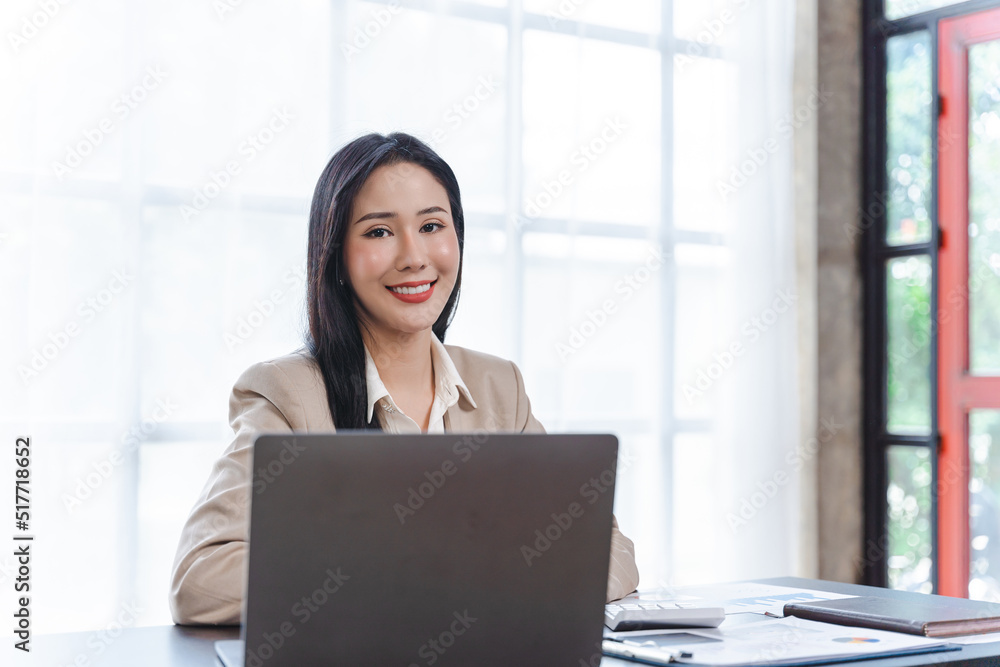 Looking camera, Portrait smiling beautiful business asian designer woman working office use computer copy space. Business owner people sme freelance online marketing e-commerce telemarketing Looking camera, Portrait smiling beautiful business asian designer woman working office use computer copy space. Business owner people sme freelance online marketing e-commerce telemarketing