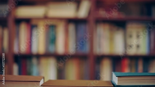 Stop motion of books disappearing in library, knowledge, people reading, hobby photo