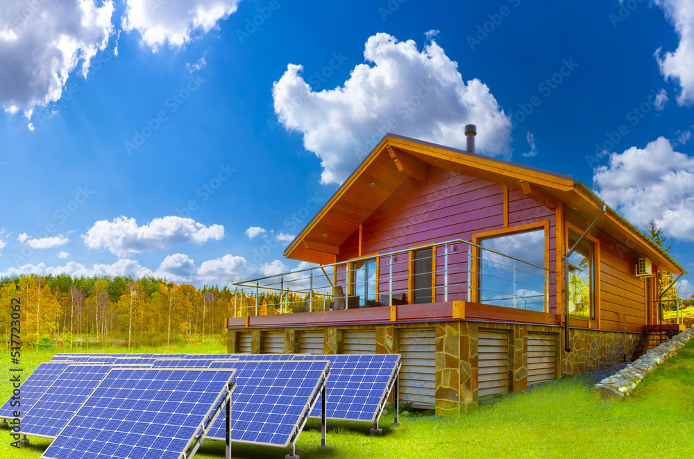 House with solar panels. Solar battery in front of cottage. Energy saving house concept. Solar panels on green lawn. Private power plant. Sun panels technology. Innovations in energy saving House with solar panels. Solar battery in front of cottage. Energy saving house concept. Solar panels on green lawn. Private power plant. Sun panels technology. Innovations in energy saving
