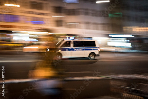 German Polizei van races through the streets of Berlin on blue light call 