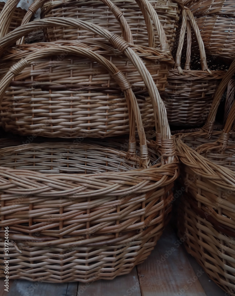 Traditional handicraft. Woven baskets with braided handles Traditional handicraft. Woven baskets with braided handles