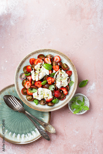 Salad with mozzarella, strawberries and cherry tomatoes