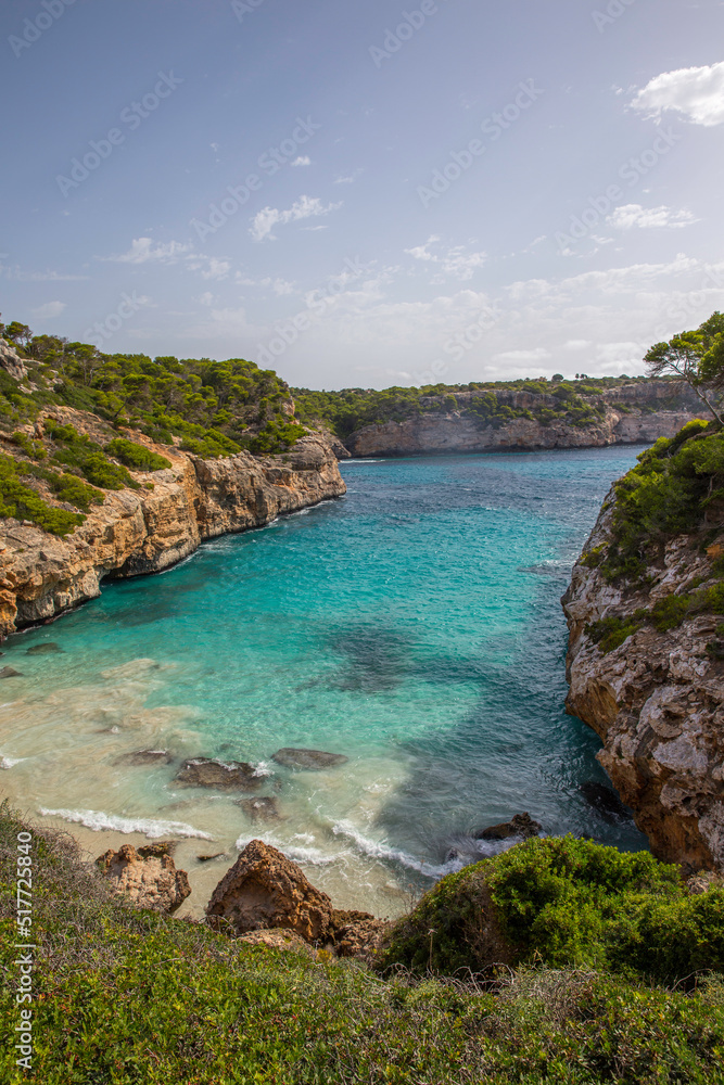 Mallorca, Spain - 08 12 2017 deserted beach in the mediterranean emerald green sea