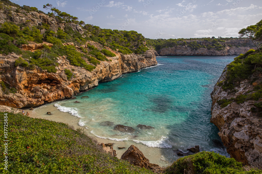 Mallorca, Spain - 08 12 2017 deserted beach in the mediterranean emerald green sea