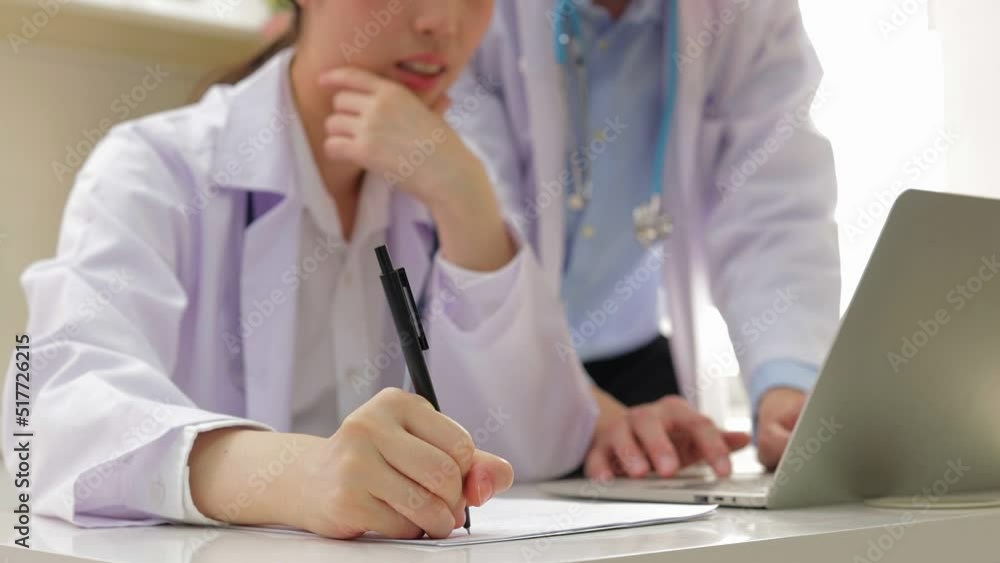 The medical team analyzes the patient's symptoms in the office. Recording treatment information in the document. concept of medical services in a hospital The medical team analyzes the patient's symptoms in the office. Recording treatment information in the document. concept of medical services in a hospital