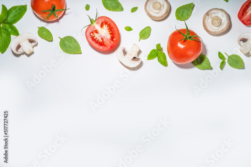 Fototapeta Naklejka Na Ścianę i Meble -  Mushrooms, tomato and basil isolated on white. Flatlay pattern on white background top view