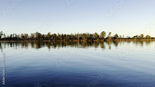 Reflection view in the river and water ripple surface on evening. Coffs HArbour, Australia. photo