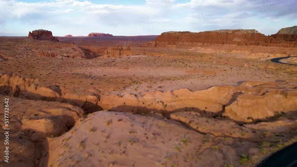 Long and lonesome road along the amazing landscape of another planet, scenic Utah. Drone footage. Famous places of USA. Wild nature and landscape form above. Long and lonesome road along the amazing landscape of another planet, scenic Utah. Drone footage. Famous places of USA. Wild nature and landscape form above.