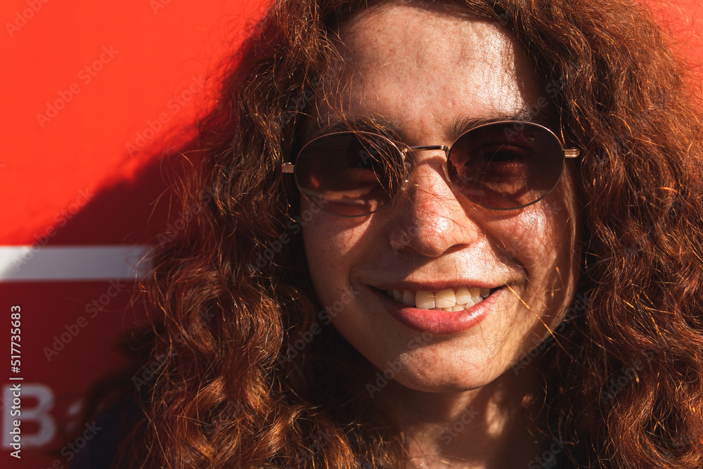 Portrait Of Happy Woman Wearing Sunglasses Portrait Of Happy Woman Wearing Sunglasses