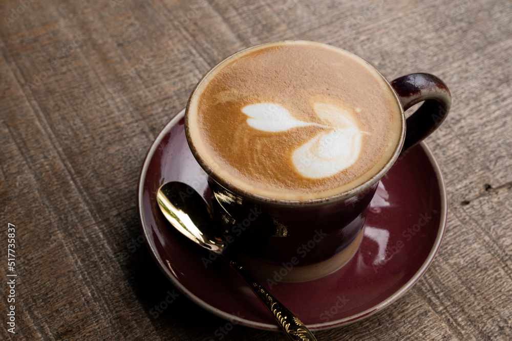 hot latte on wooden table