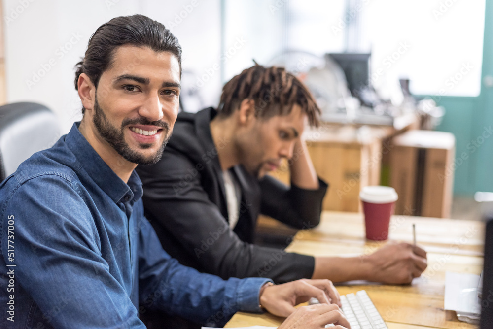 Focused multiethnic colleagues working in office Focused multiethnic colleagues working in office